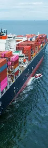 A large container ship on a blue sea